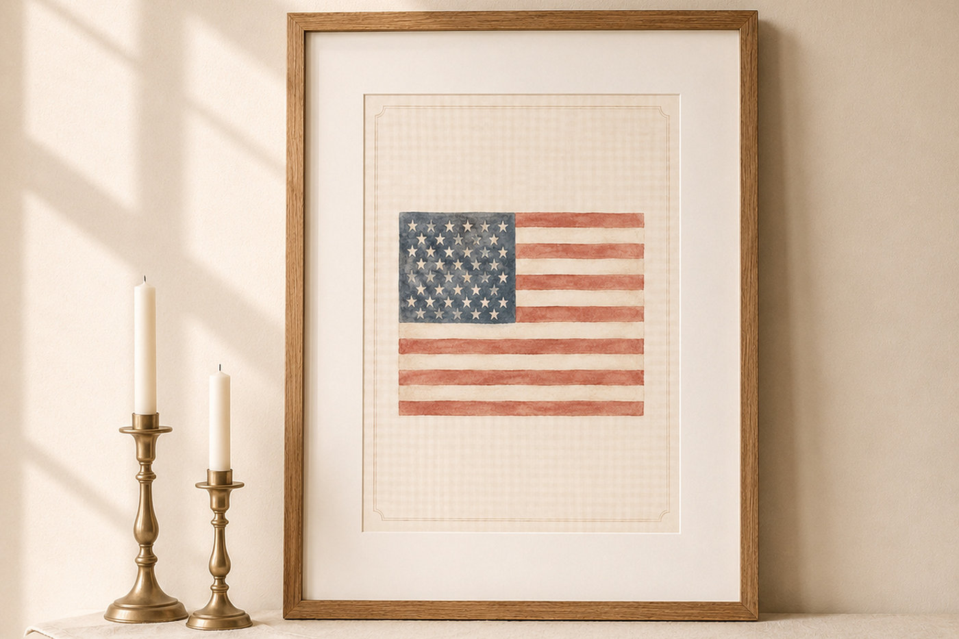 The Vintage Americana watercolor printable in a vintage oak frame on a cream mantel with brass candlesticks.